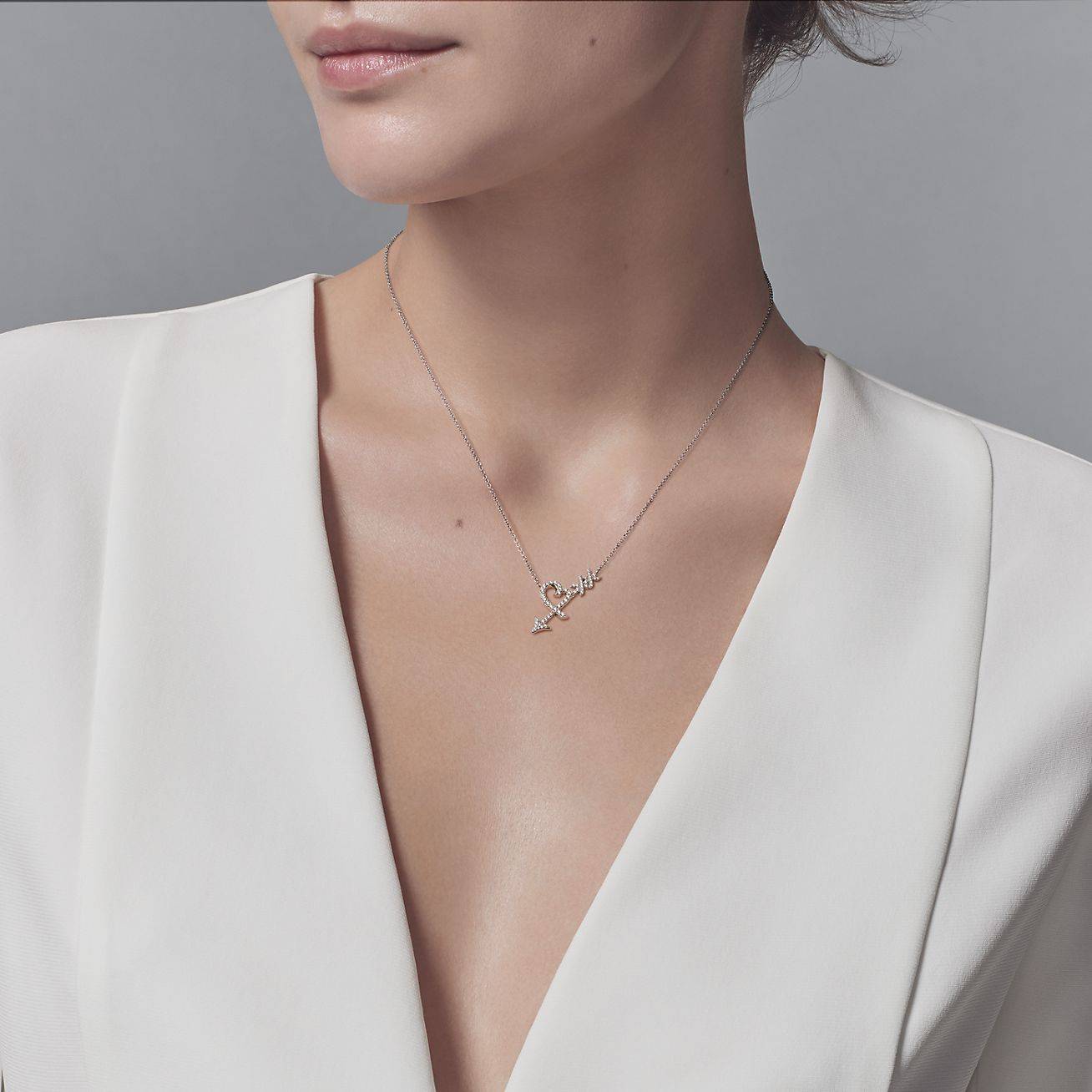 T*f*ny palomas graffiti heart arrow pendant
